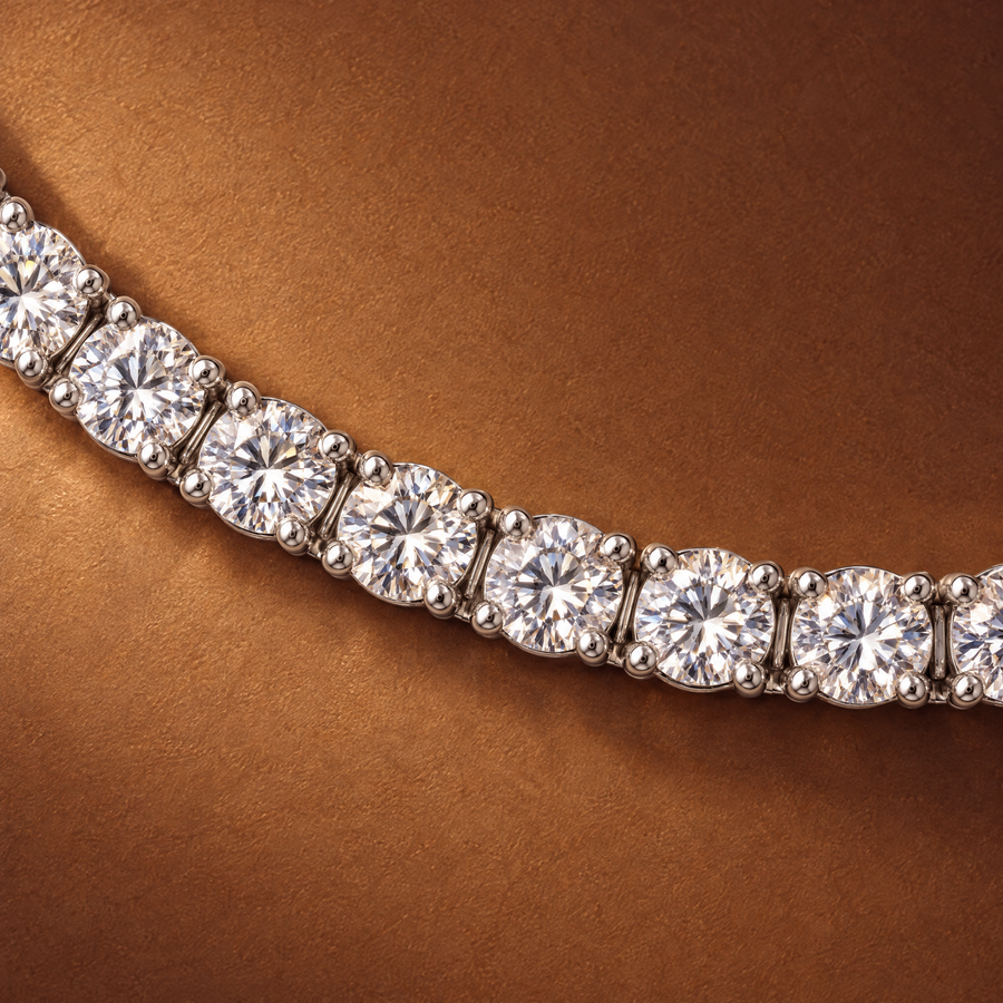 Close-up of round lab-grown diamonds in four-prong 14K white gold settings on a 5 carat tennis bracelet, AI-generated image — DEEVE