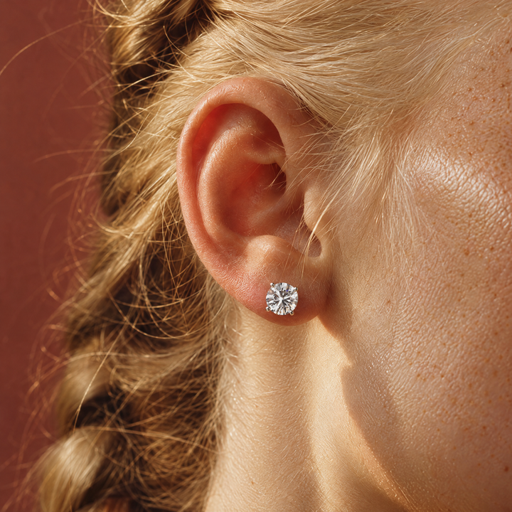 2 carat lab-grown diamond stud earrings in 14K white gold worn on the ear — AI-generated image — DEEVE