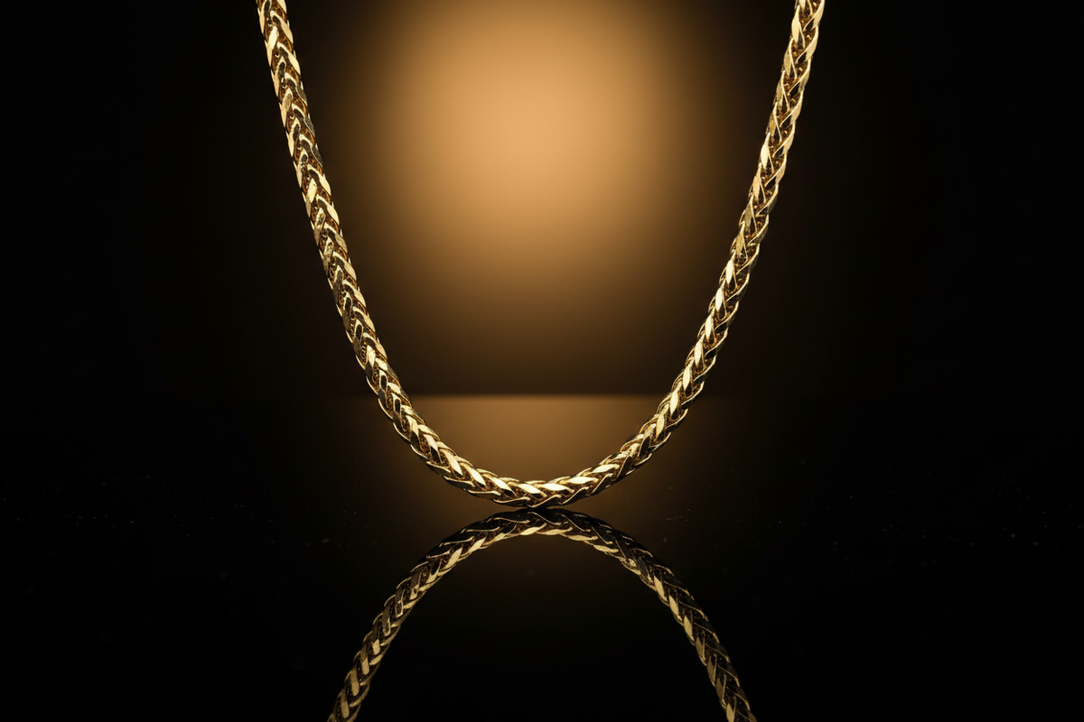 24k yellow gold luxury franco chain on dark reflective background and Deeve's jewelry logo