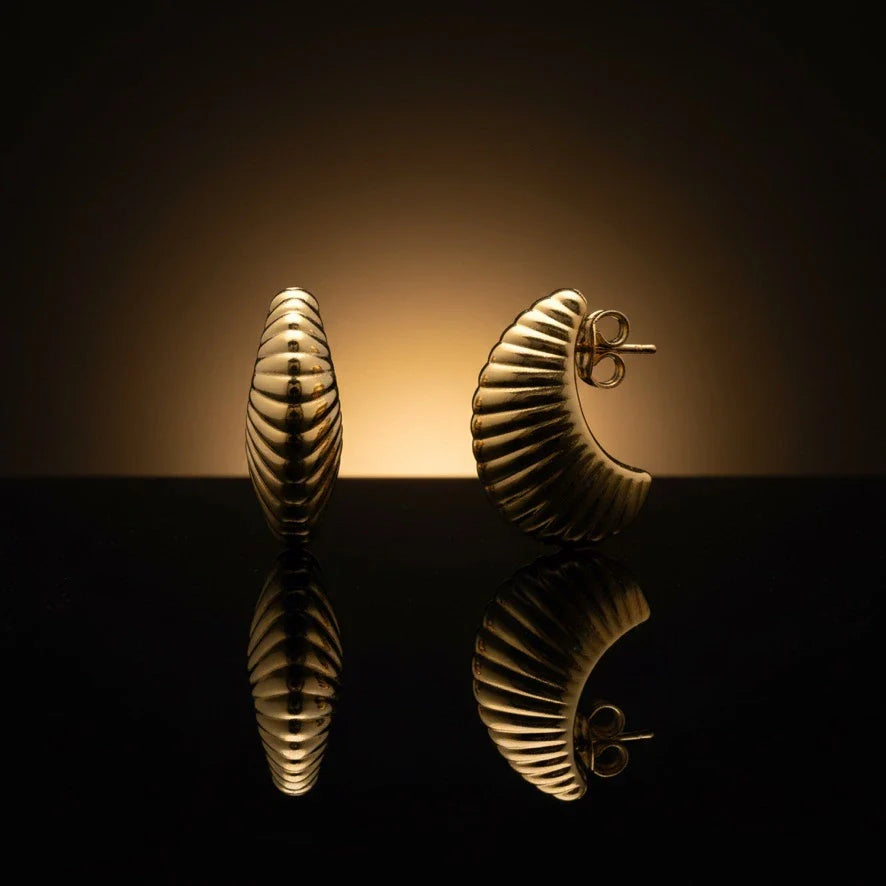 14K gold puffy scallop c hoop earrings on a dark reflective background from Deeve Jewelry Canada