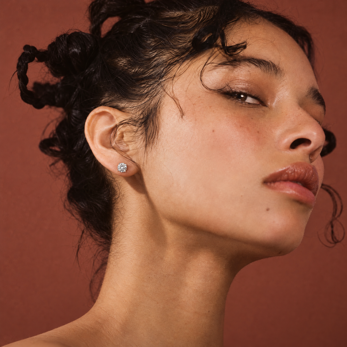 Model wearing 1 carat lab-grown diamond stud earrings in 14K white gold, AI-generated image — DEEVE