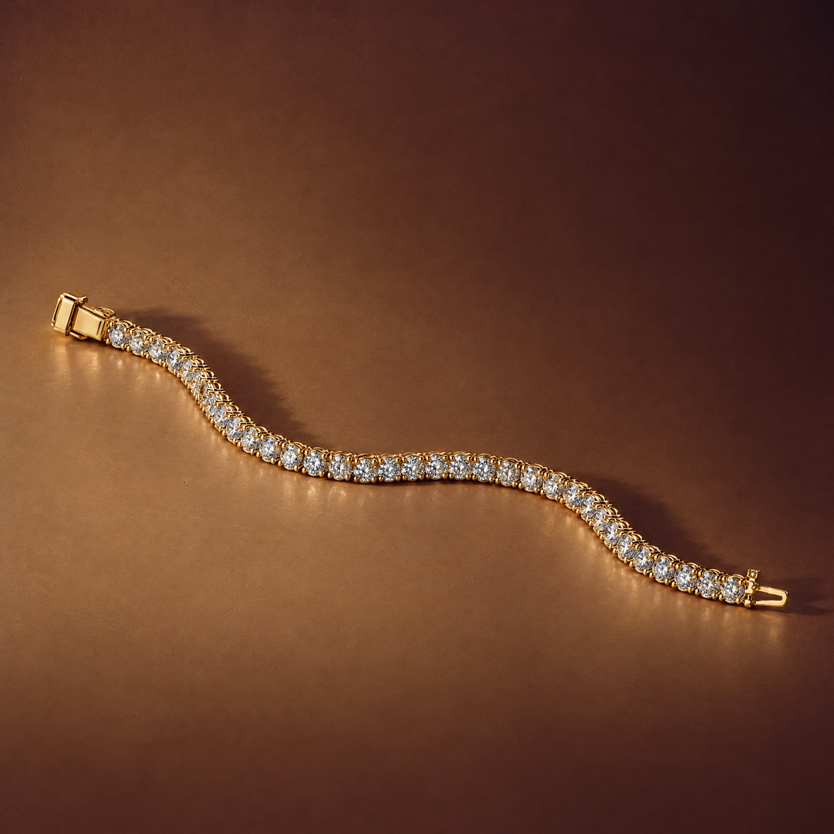 5 carat lab-grown diamond tennis bracelet in 14K yellow gold lying flat on a brown background, AI-generated image — DEEVE