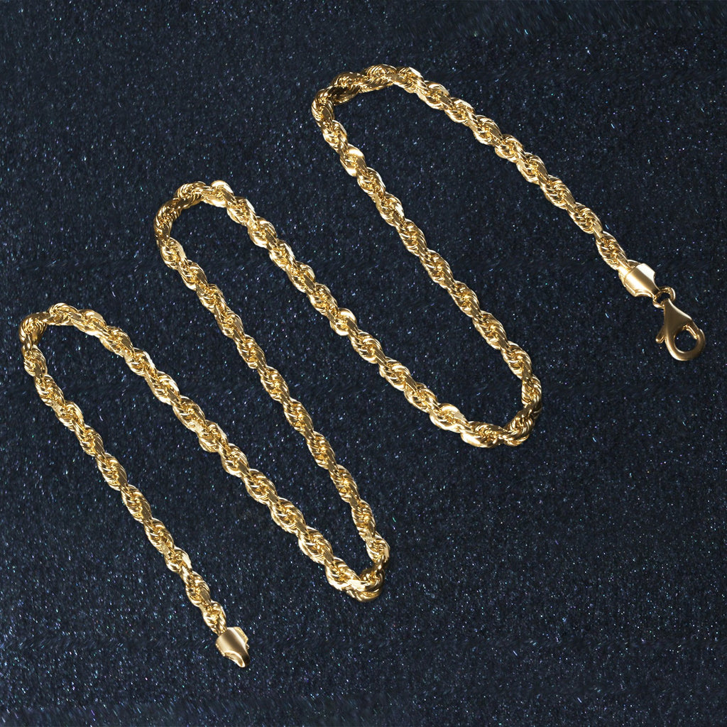 Diamond-cut rope chain in 14K yellow gold laid out in loops
