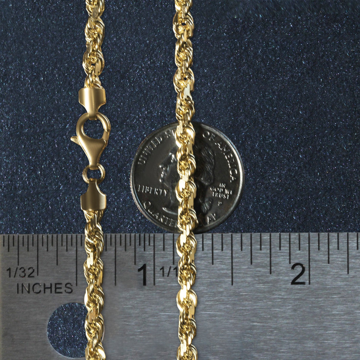 5.00mm rope chain in 14K yellow gold beside an inch ruler and a coin for scale