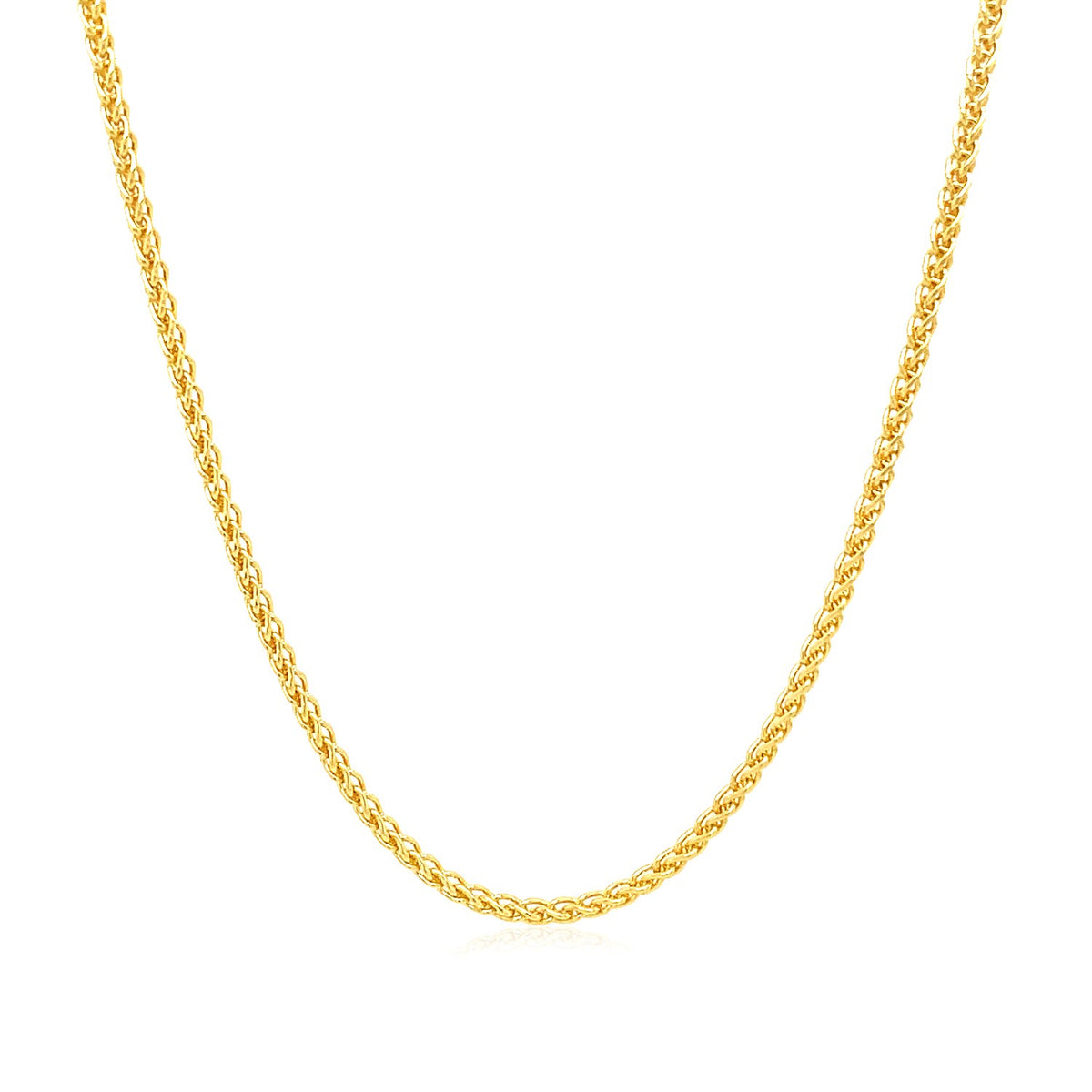 Wheat chain in 14K yellow gold hanging in a curve