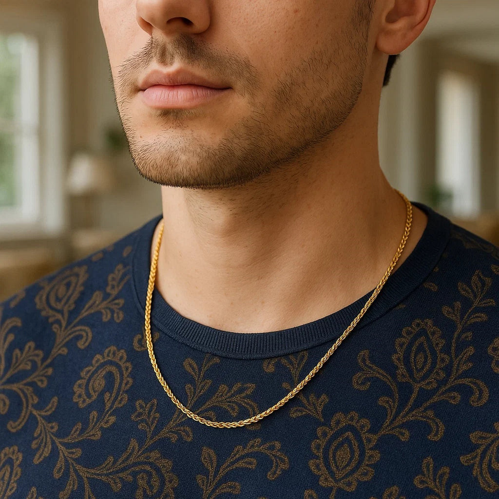 Wheat chain in 14K yellow gold worn with a navy patterned shirt
