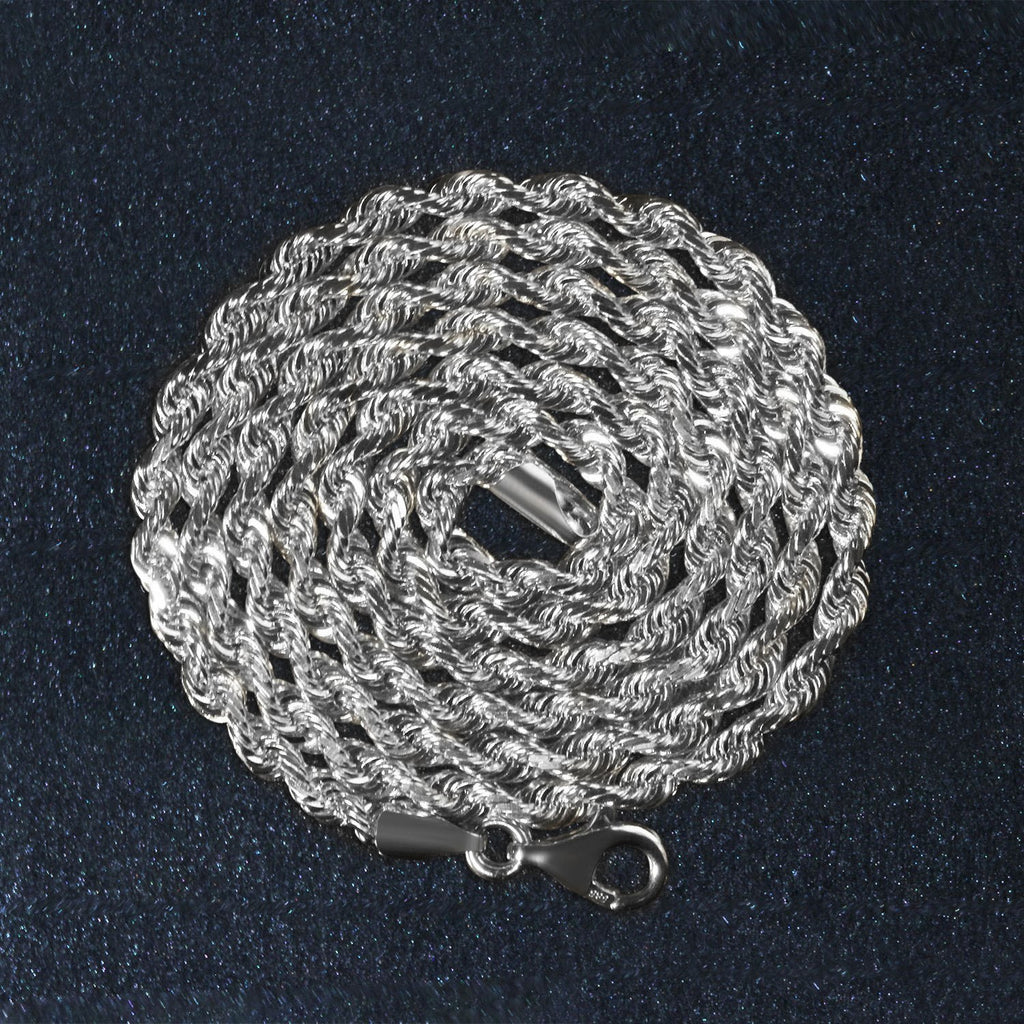 14K white gold rope chain, 3.00mm, coiled on a dark surface