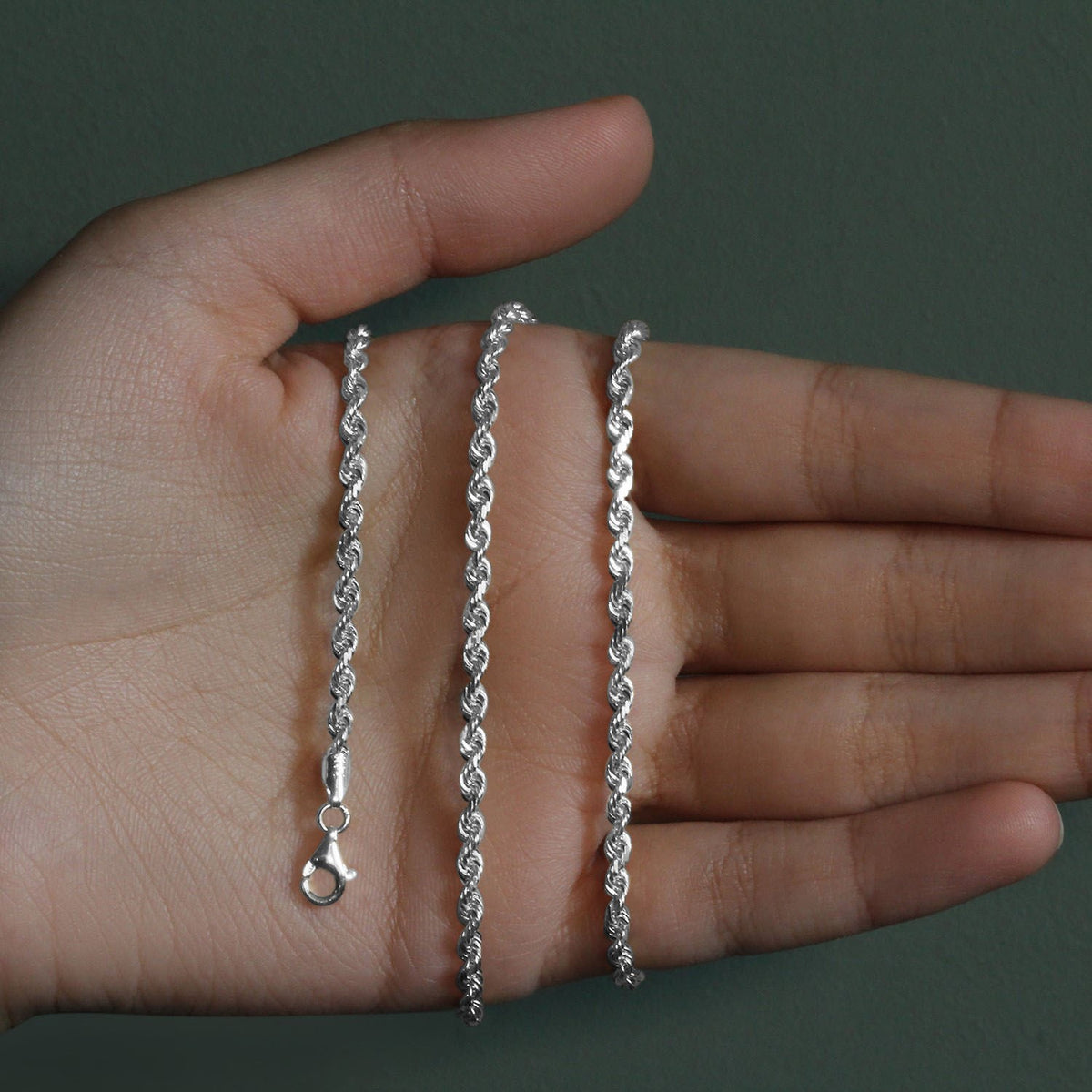 3.00mm rope chain in 14K white gold held across an open palm
