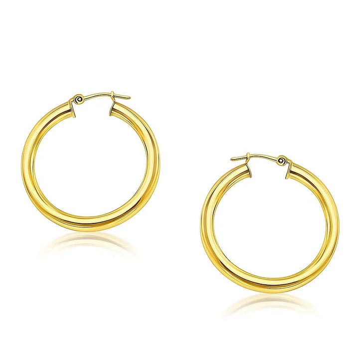 Polished 30mm hoop earrings in 14K yellow gold, 4mm wide, front view of the pair