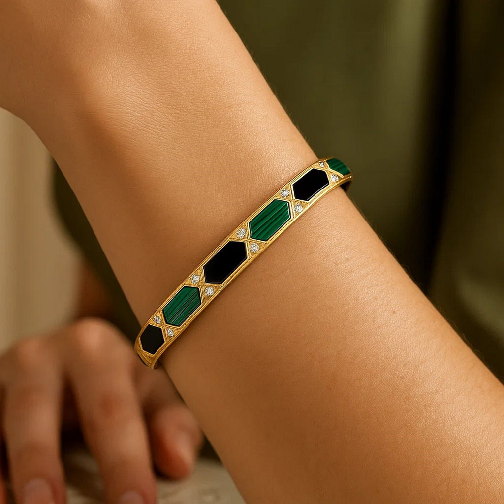 Close view of the onyx and malachite Art Deco bangle on the arm
