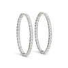 Front view of 14K white gold oval diamond hoop earrings, two-sided setting