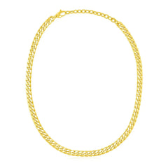 Cuban chain choker in 14K yellow gold laid in a loop