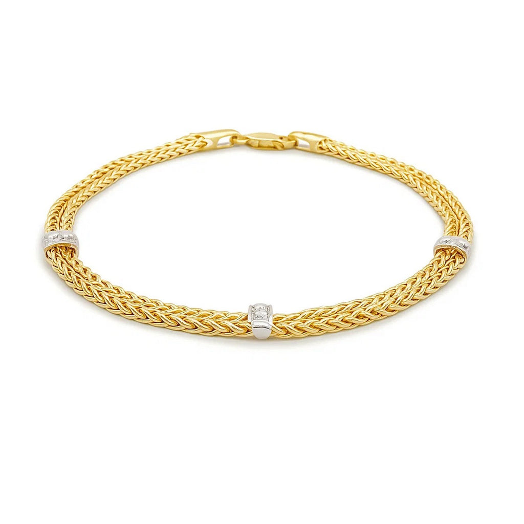 Front view of 14K two-tone wheat chain bracelet with diamond bar stations
