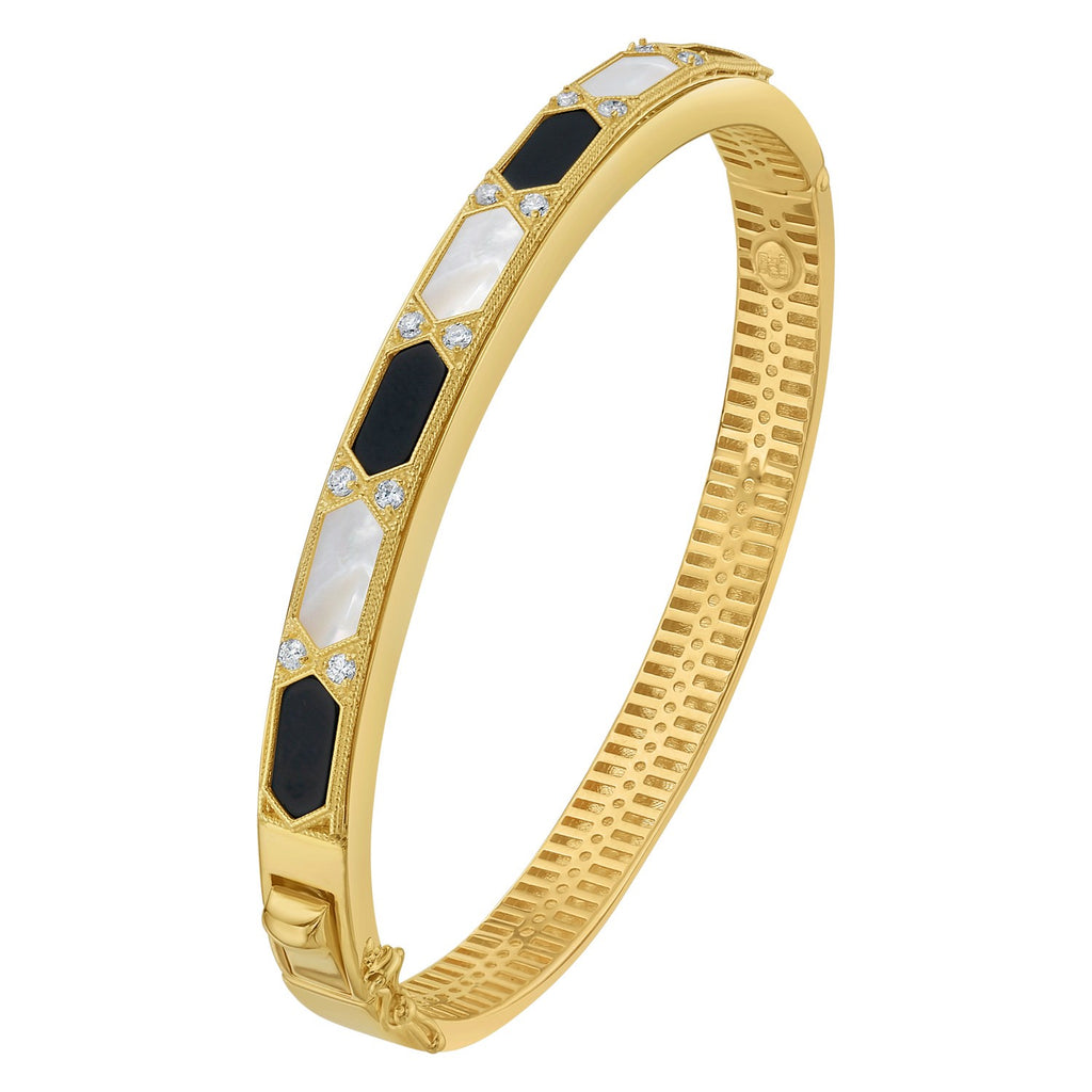 14K yellow gold Art Deco bangle at an angle, showing the black onyx and mother-of-pearl hexagons