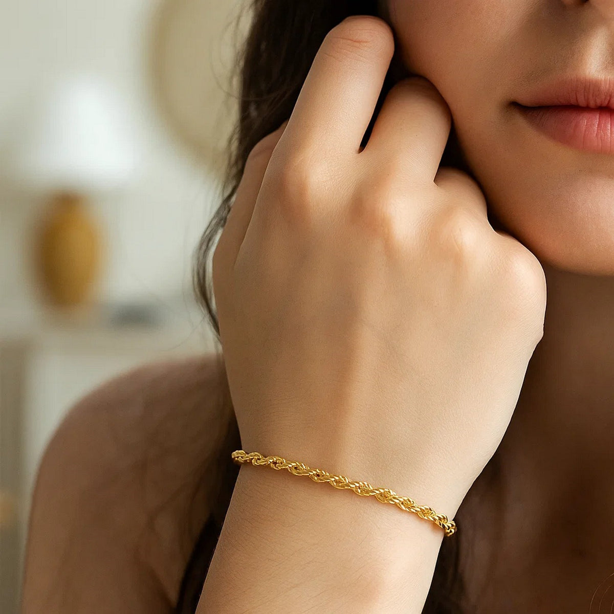 Rope bracelet in 14K yellow gold worn on the wrist