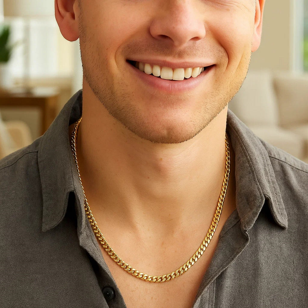 4.0mm solid Miami Cuban chain in 14K yellow gold worn with an open-collared shirt