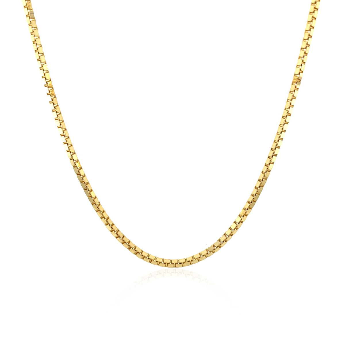 Box chain in 14K yellow gold hanging in a curve