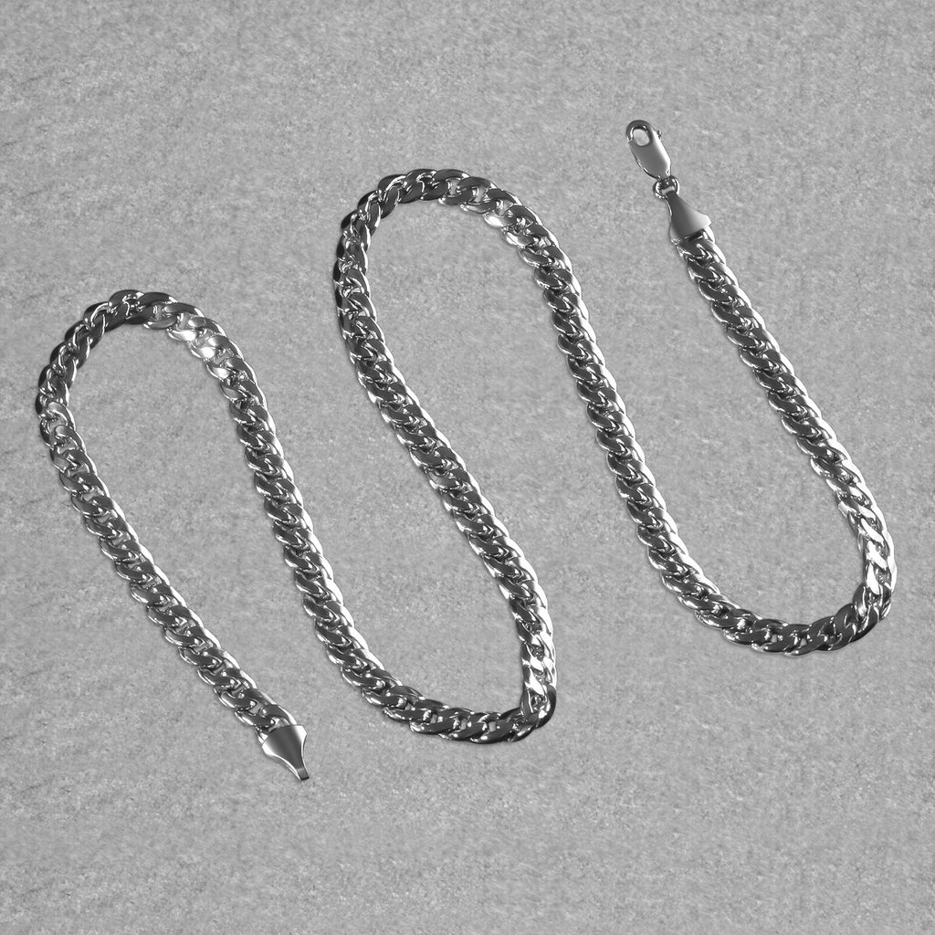 7.00mm Miami Cuban chain in 14K white gold laid out in an S-curve