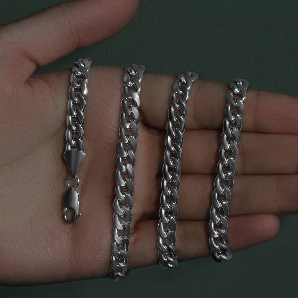 7.00mm Miami Cuban chain in 14K white gold held across an open palm