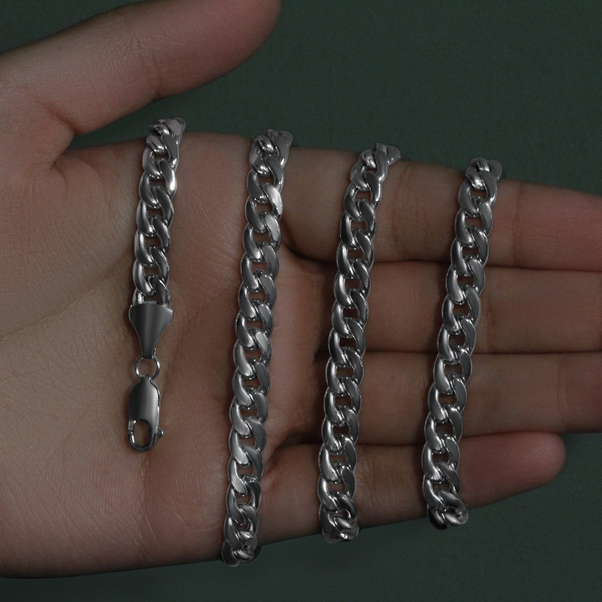 7.00mm Miami Cuban chain in 14K white gold held across an open palm