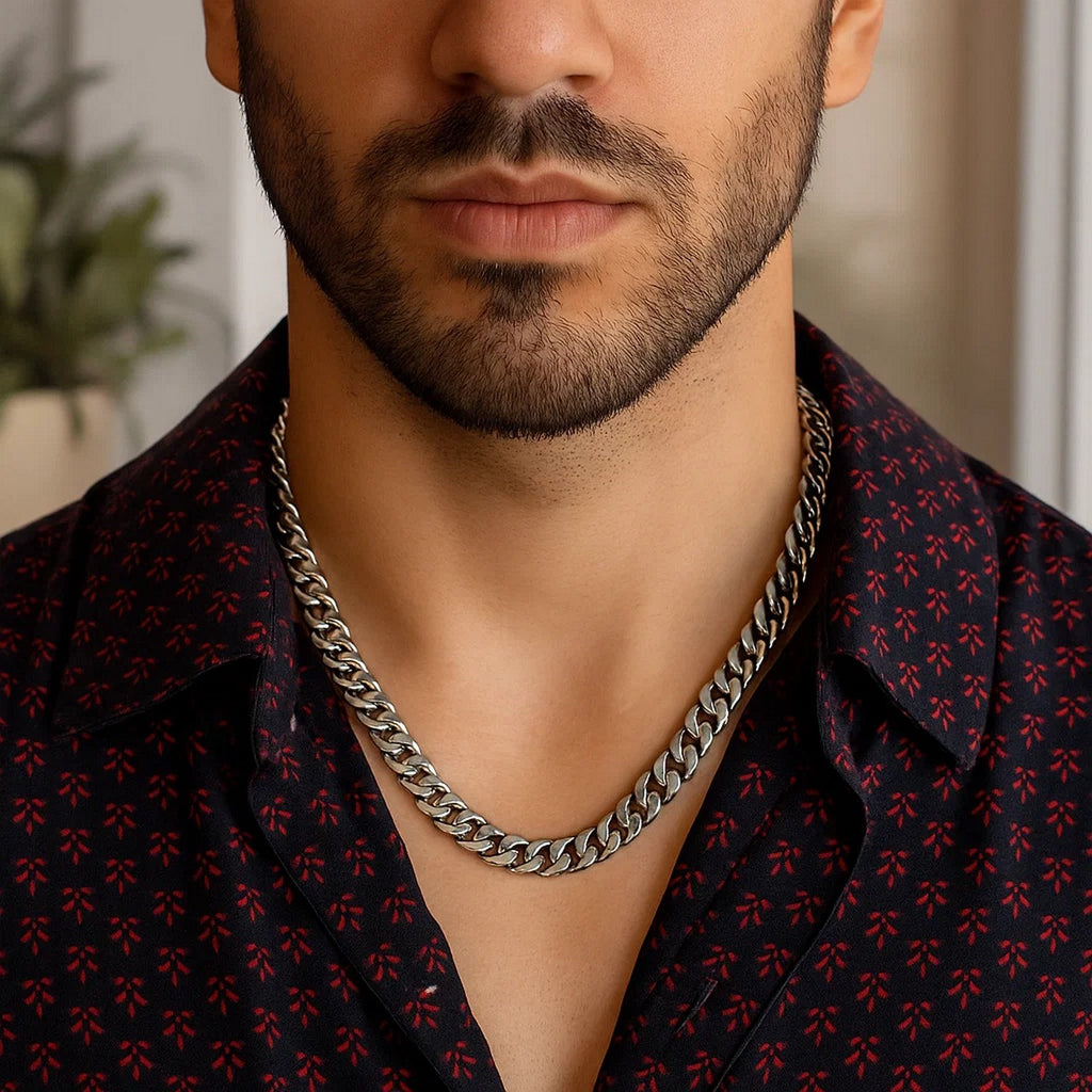 7.00mm Miami Cuban chain in 14K white gold worn with a dark open-collared shirt