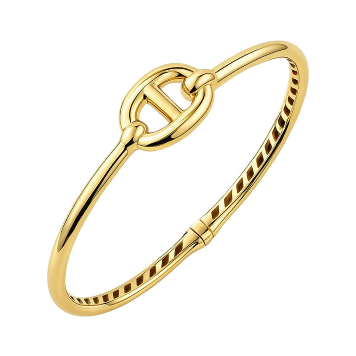 Mariner link hinged bangle in 14K yellow gold with a 12mm puffed link at the center