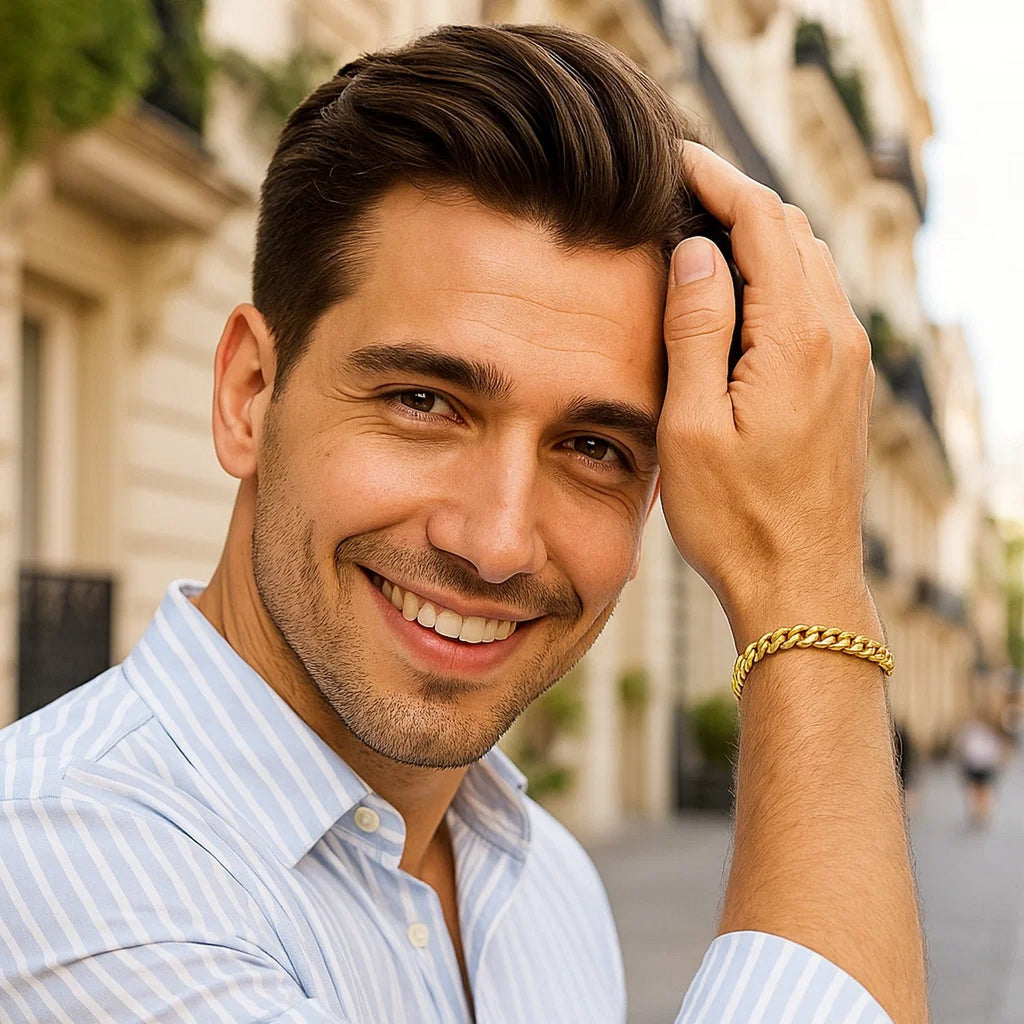 Man in a striped shirt wearing the 14K yellow gold Miami Cuban bracelet