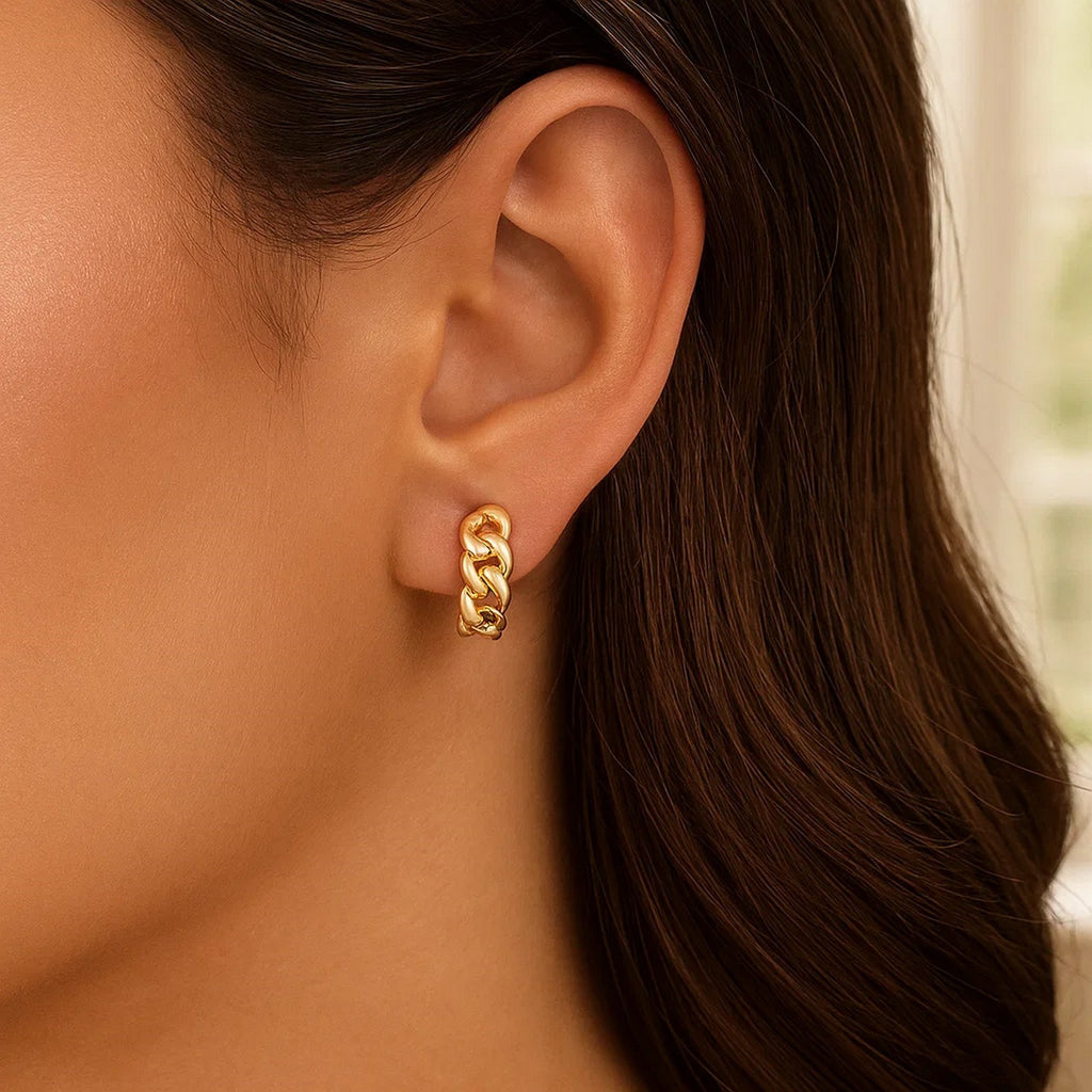 Curb chain 14K yellow gold huggie on the ear, side view