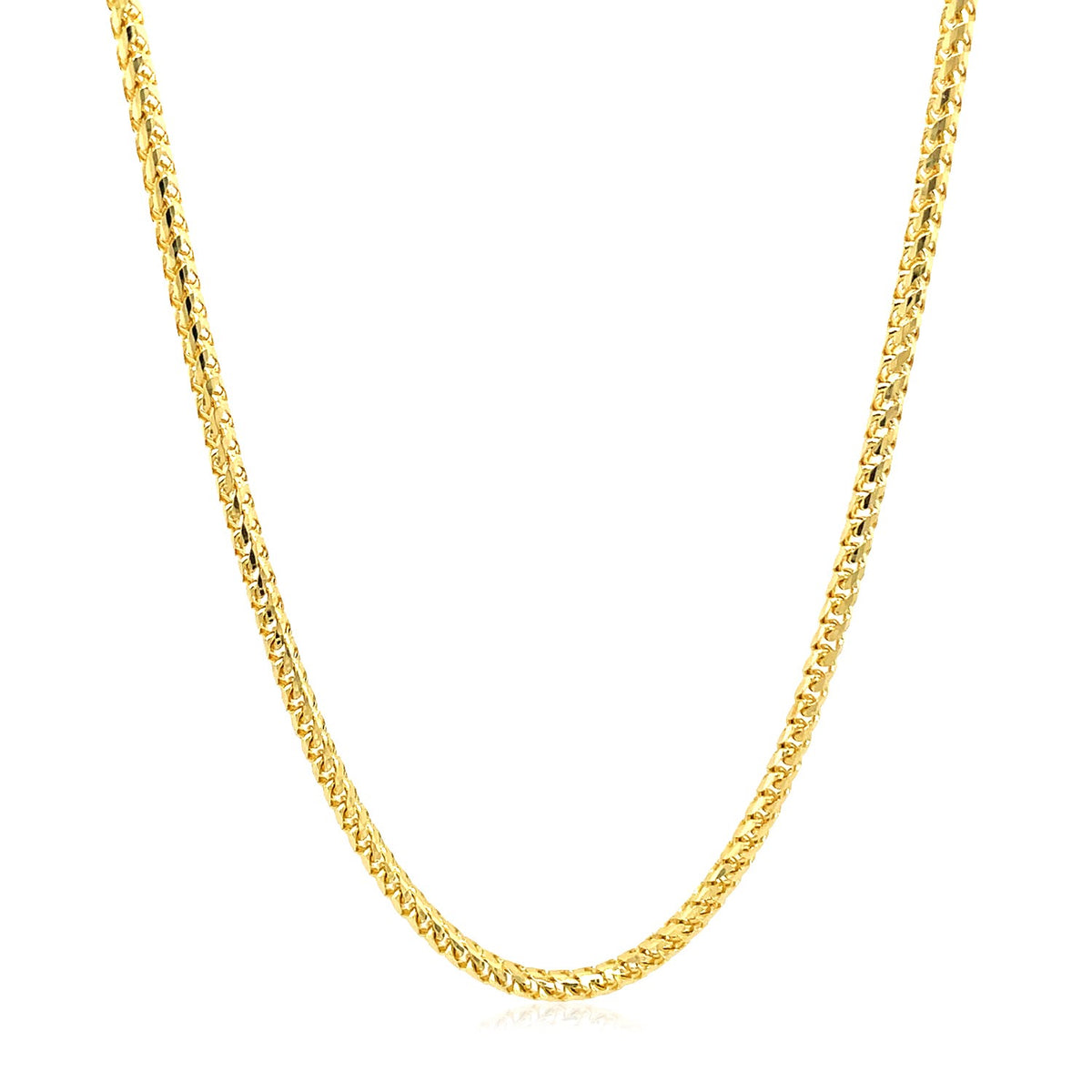 Solid Franco chain in 14K yellow gold hanging in a curve