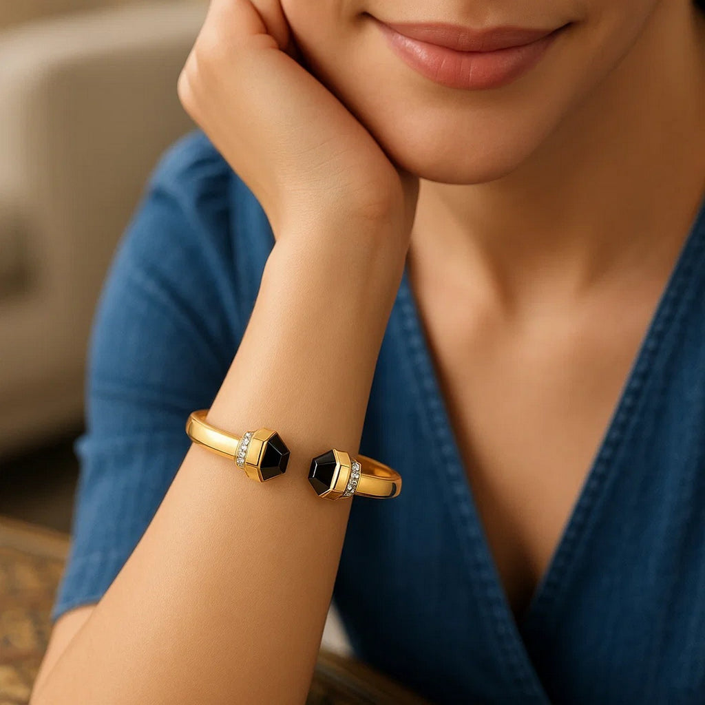 Woman wearing the 14K yellow gold black onyx cuff