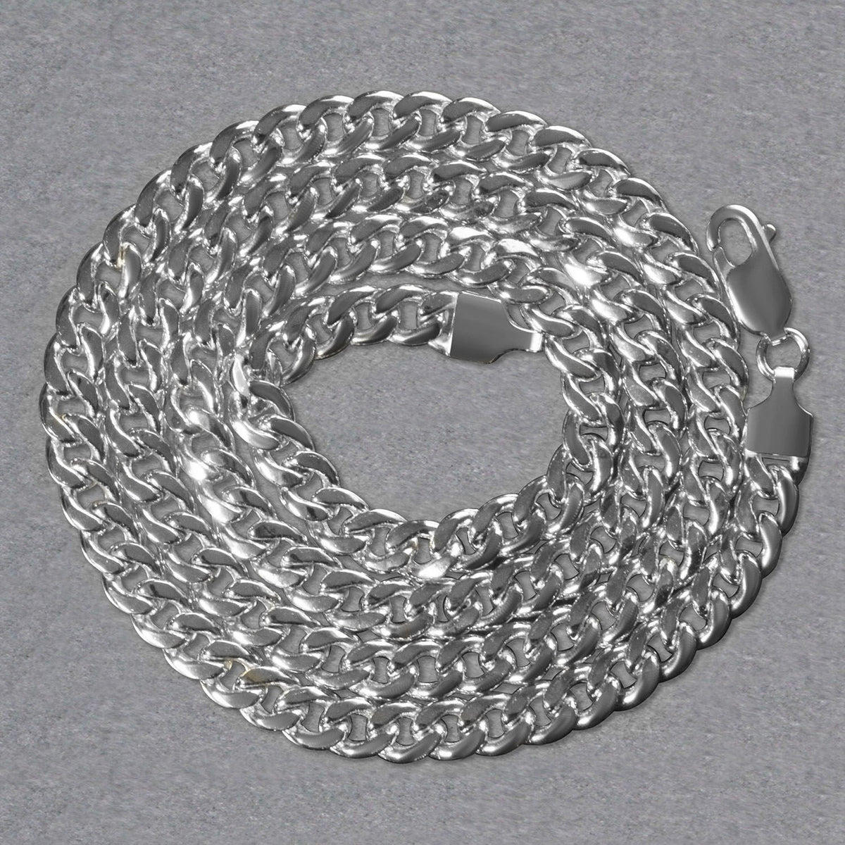 14K white gold Miami Cuban chain, 5.50mm, coiled to show the links