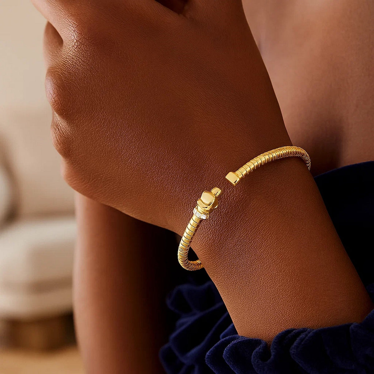 Panther tubogas cuff with diamonds in 14K yellow gold worn on the arm