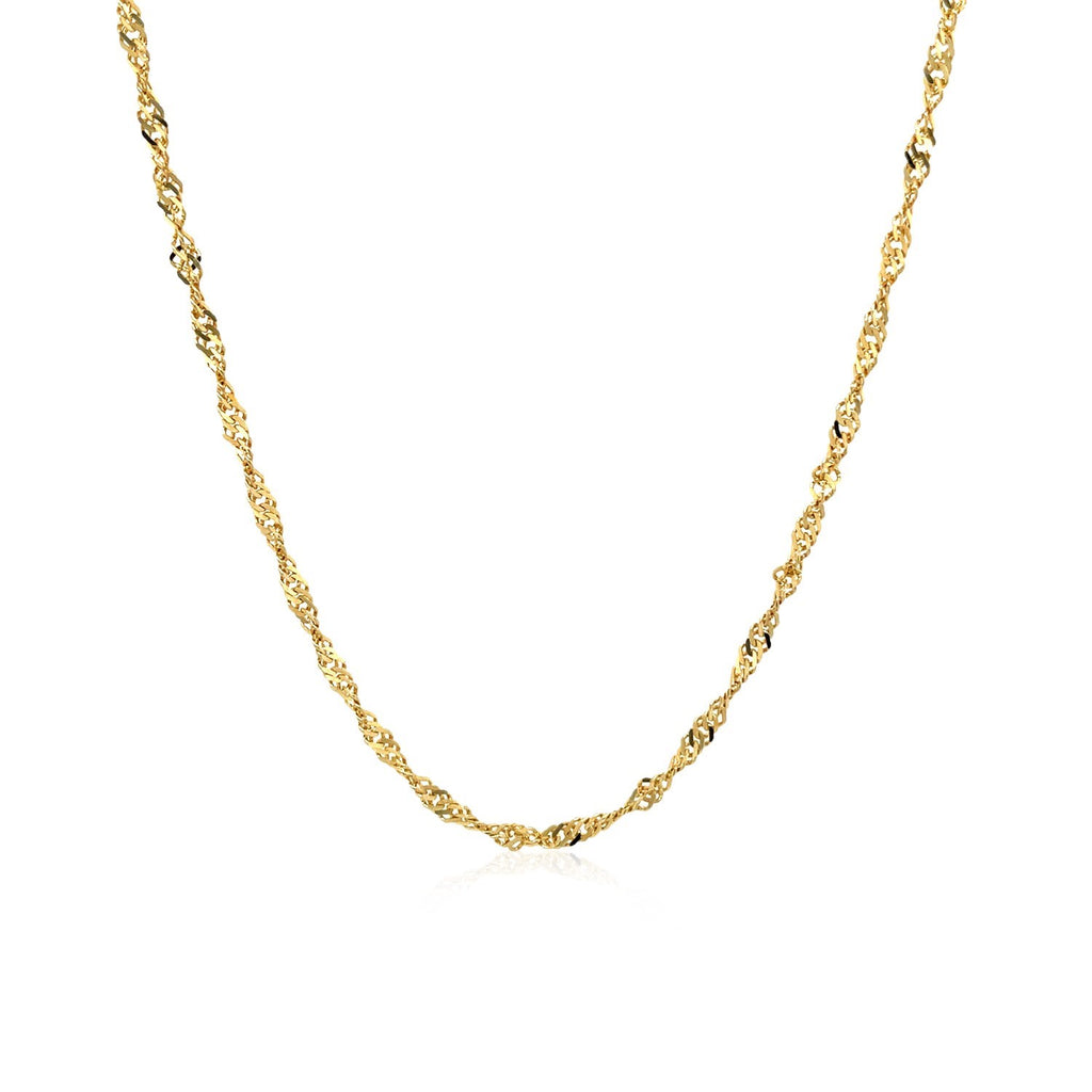 Singapore chain in 14K yellow gold hanging in a curve