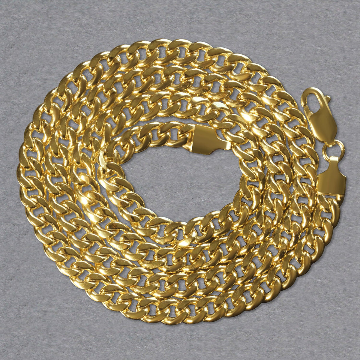 14K yellow gold Miami Cuban chain, 5.50mm, coiled to show the links