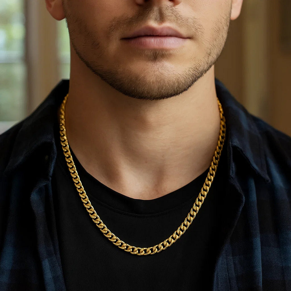 5.50mm Miami Cuban chain in 14K yellow gold worn over a black T-shirt