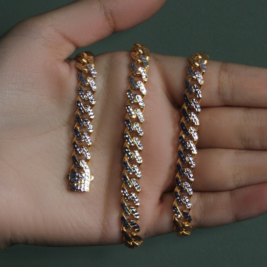 8.00mm two-tone Miami Cuban chain held across an open palm