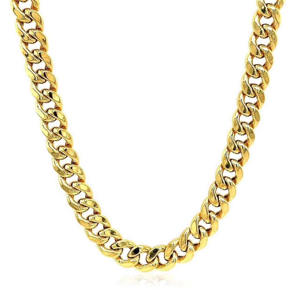 Semi-solid Miami Cuban chain in 14K yellow gold hanging in a curve