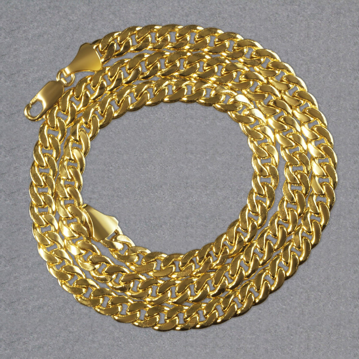 14K yellow gold Miami Cuban chain, 7.00mm, coiled to show the links