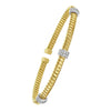 Front view of 14K yellow gold tubogas cuff bracelet with three prong-set diamond stations, 0.30 cttw minimum
