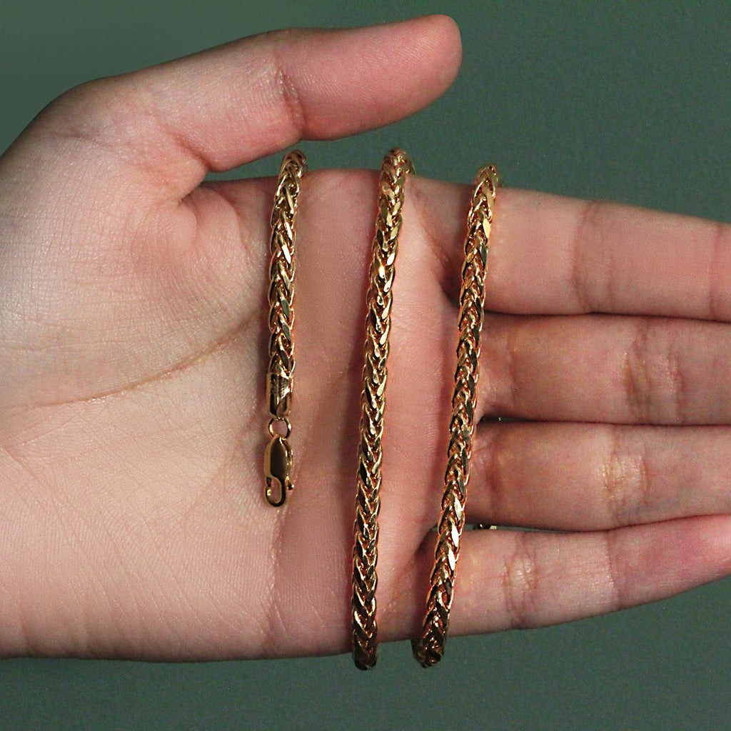 4.1mm Franco chain in 14K yellow gold held across an open palm