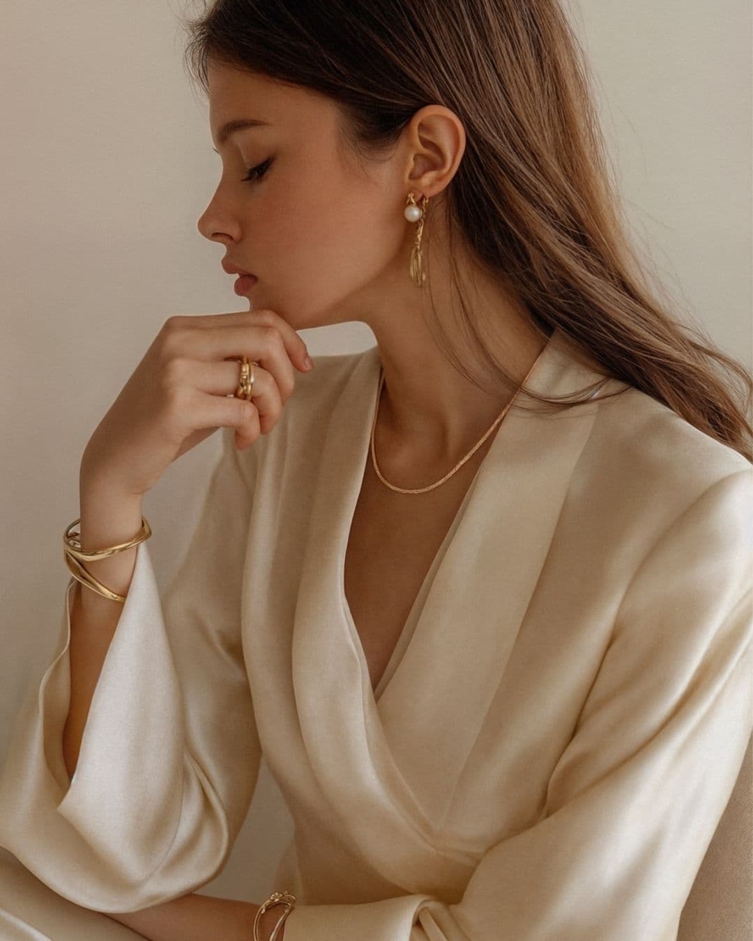 lady in white wearing Deeve 14k gold jewelry