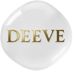 White heart-shaped object with 'DEEVE' engraved in gold on a white background