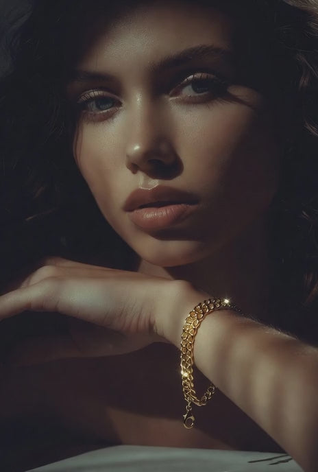 promotional video of a model wearing a light Miami cuban link chain bracelet in 14k yellow gold 