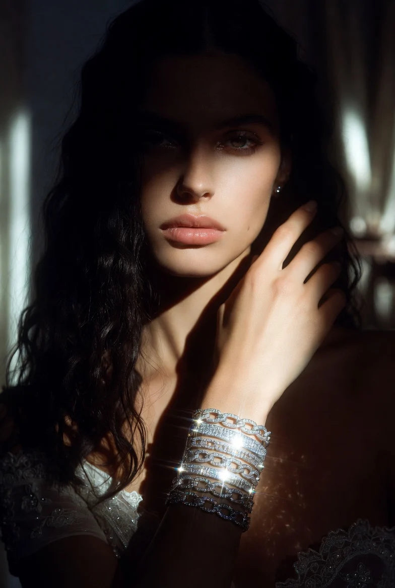 Woman with dark hair wearing lab grown diamond tennis bracelet from DEEVE jewelry, with a soft focus background